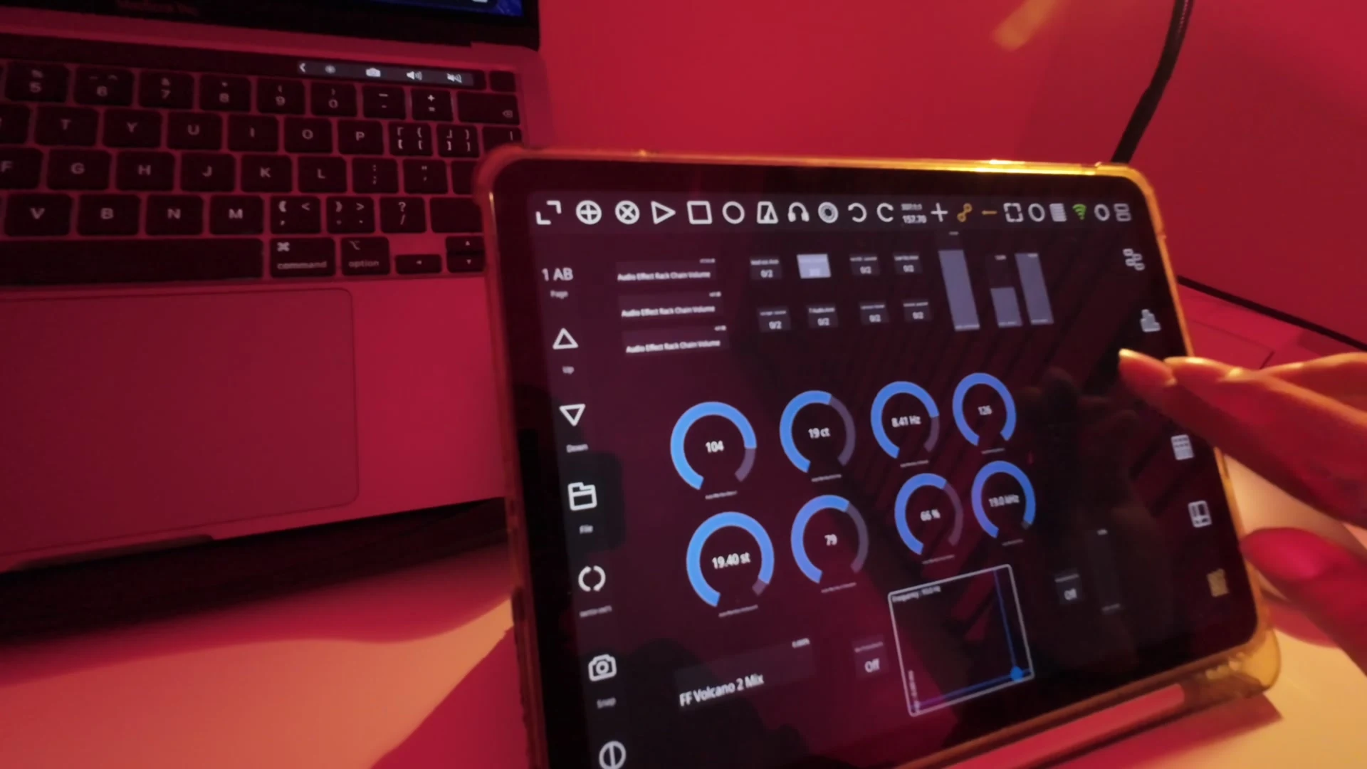 The customised TouchAble Pro interface on an iPad: a page of circular parameter controls for live vocal processing, lit red