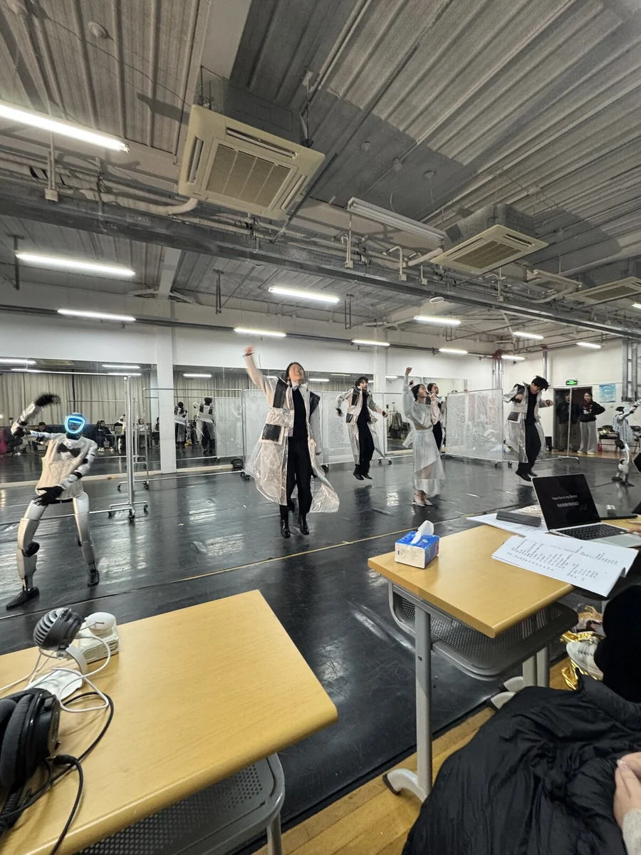 Rehearsal: the humanoid robot dancing alongside the cast in the rehearsal room